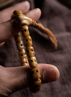 Hand Carved Citipati Lord of the Cemetery Single Strand Mala Bracelet Natural Aged Wild Yak Bone Skull Prayer Bead Bracelet Handcrafted Vintage Tibetan Style Yak Bone Wrist Bracelet